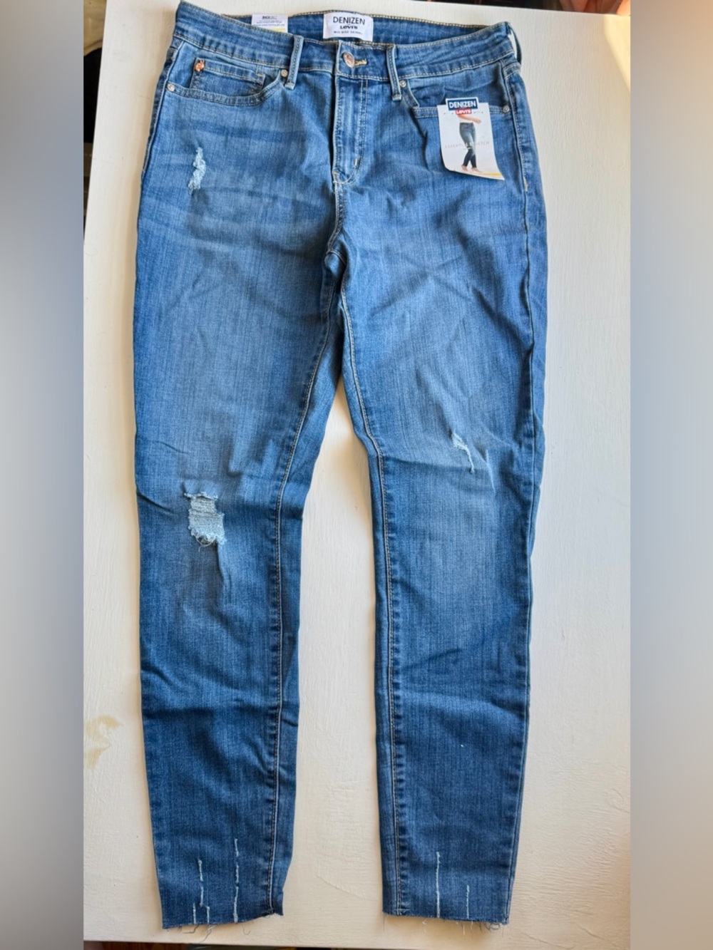 Levi's Women's Distressed Mid Rise Skinny Jean with Raw Hem